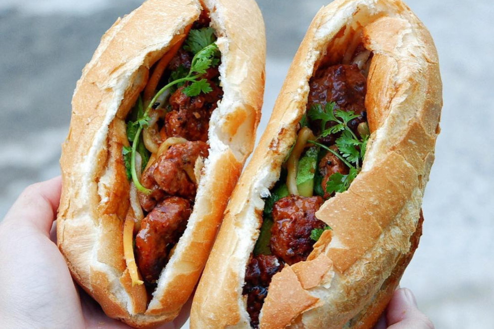 The flavorful, juicy pork meatballs combined with the crispy, fragrant baguette create a perfect banh mi